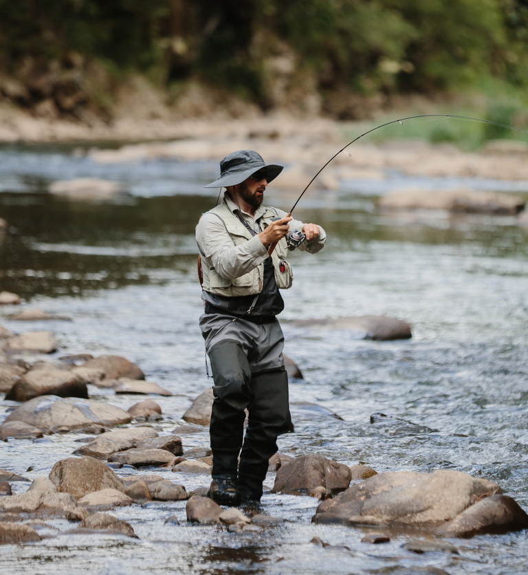Man fishing in stream